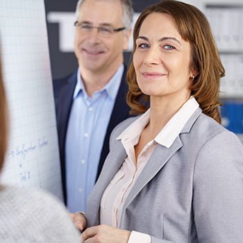 woman smiling during a business meeting