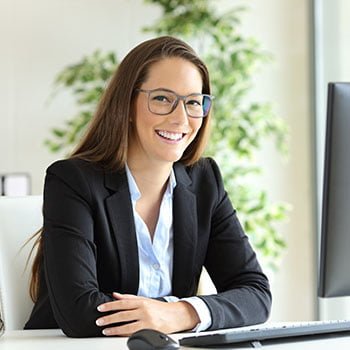 woman smiling at desk