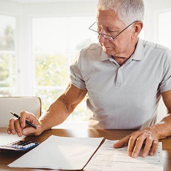 man calculating numbers at home