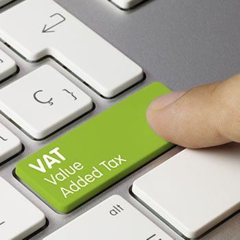 Green keyboard button that says VAT value added tax