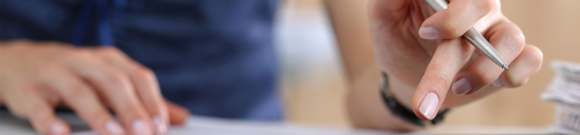 woman working with pen in hand